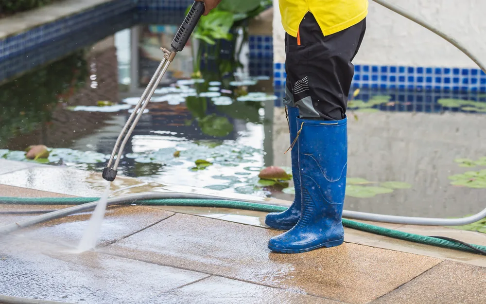 Cleaning a poolside patio deck